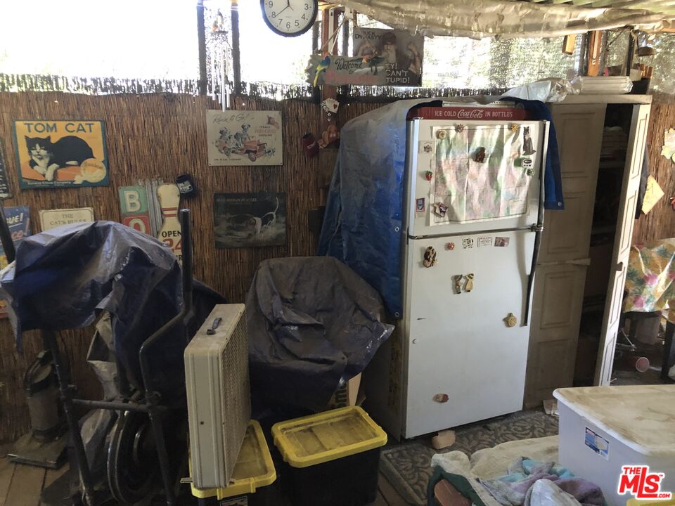 32886 Wildomar Trail Wildomar, CA 92595 - Photo 4 of 22 a view of walk in closet with clothes and shoes