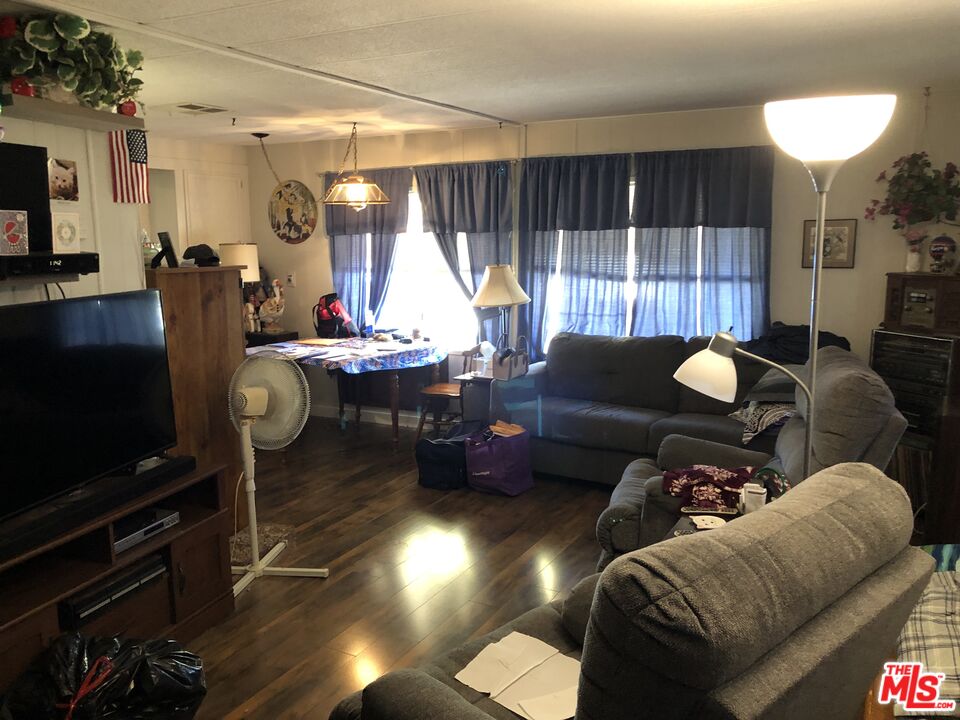 32886 Wildomar Trail Wildomar, CA 92595 - Photo 5 of 22 a living room with furniture and a flat screen tv