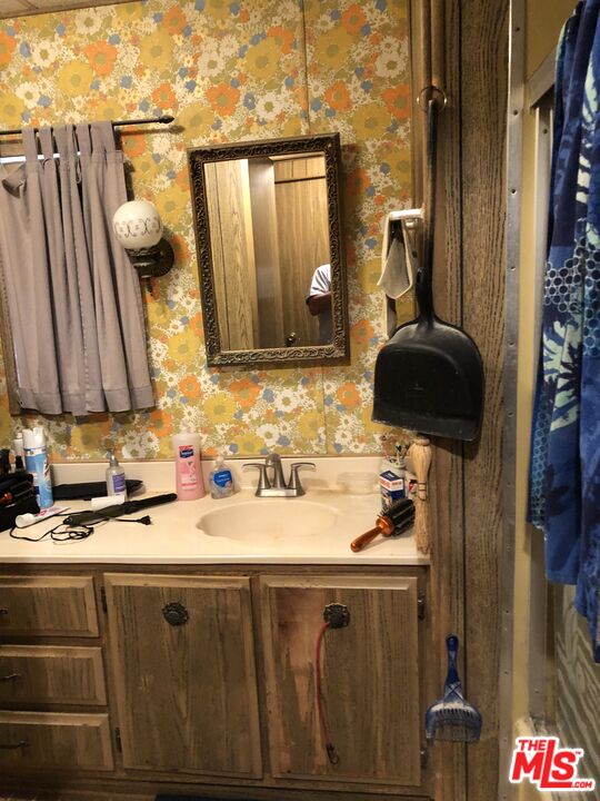 32886 Wildomar Trail Wildomar, CA 92595 - Photo 8 of 22 a bathroom with a sink and a mirror