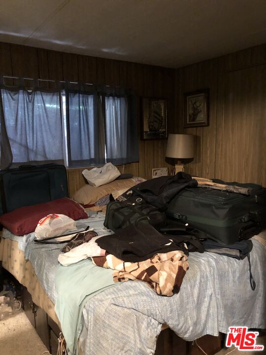 32886 Wildomar Trail Wildomar, CA 92595 - Photo 9 of 22 a bed room with a bed and a couch