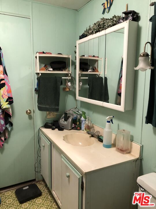 32886 Wildomar Trail Wildomar, CA 92595 - Photo 10 of 22 a bathroom with a sink and mirror