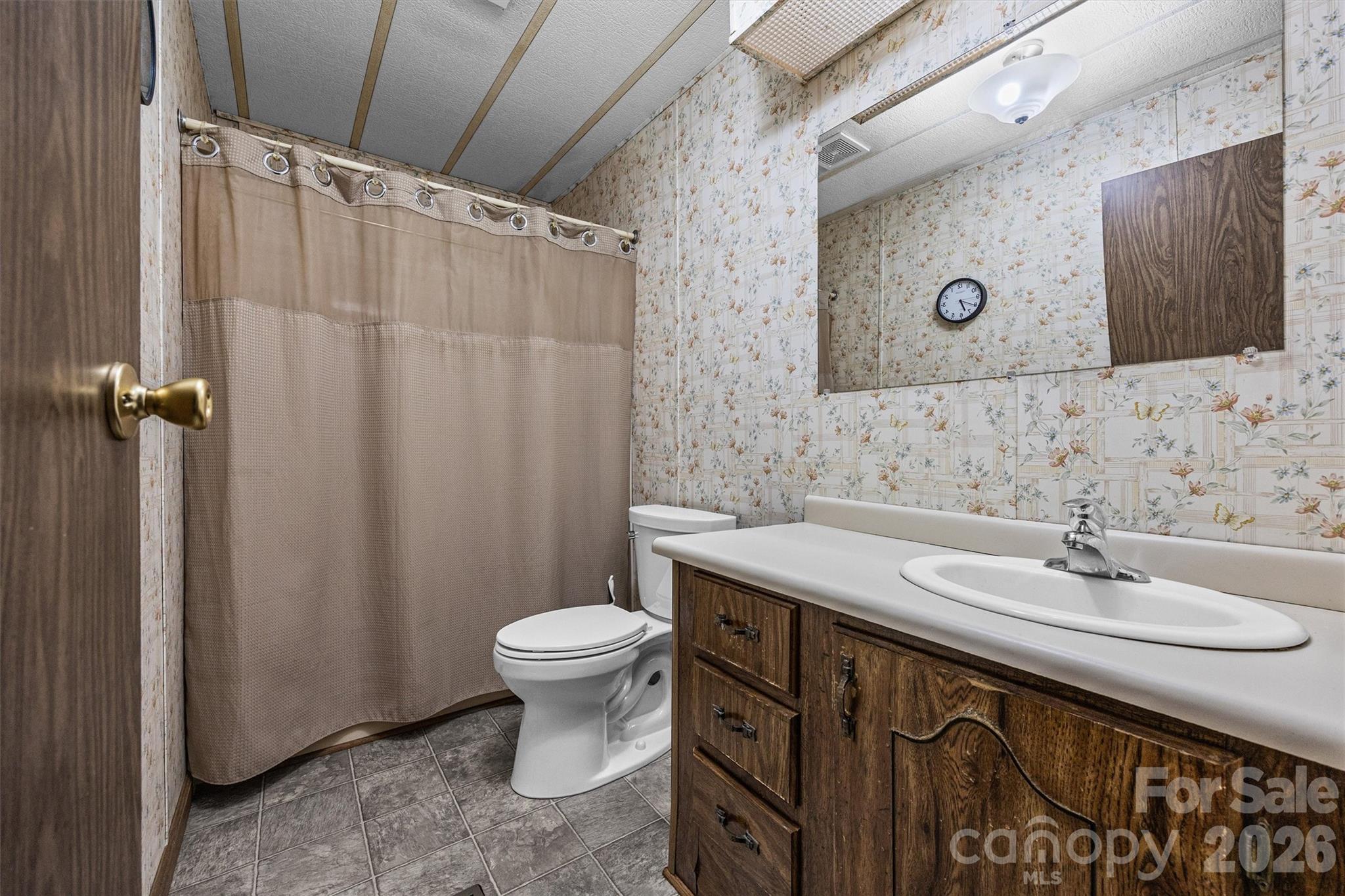 2071 Chameleon Road, Unit 156 York, SC 29745 - Photo 22 of 46 a bathroom with a sink toilet a mirror and shower