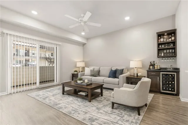 a bedroom with a bed a table and chair