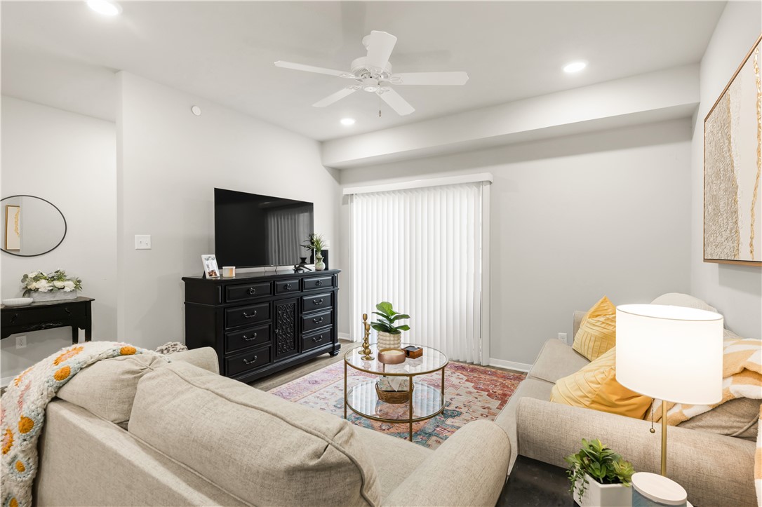1326 Prairie Drive, Unit 113 Bryan, TX 77803 - Photo 12 of 21 Living room featuring recessed lighting, a ceiling