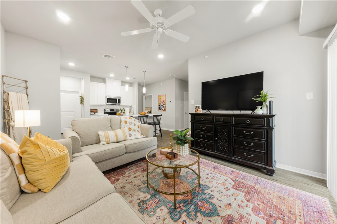 1326 Prairie Drive, Unit 113 Bryan, TX 77803 - Photo 13 of 21 Living area with baseboards, recessed lighting, ce