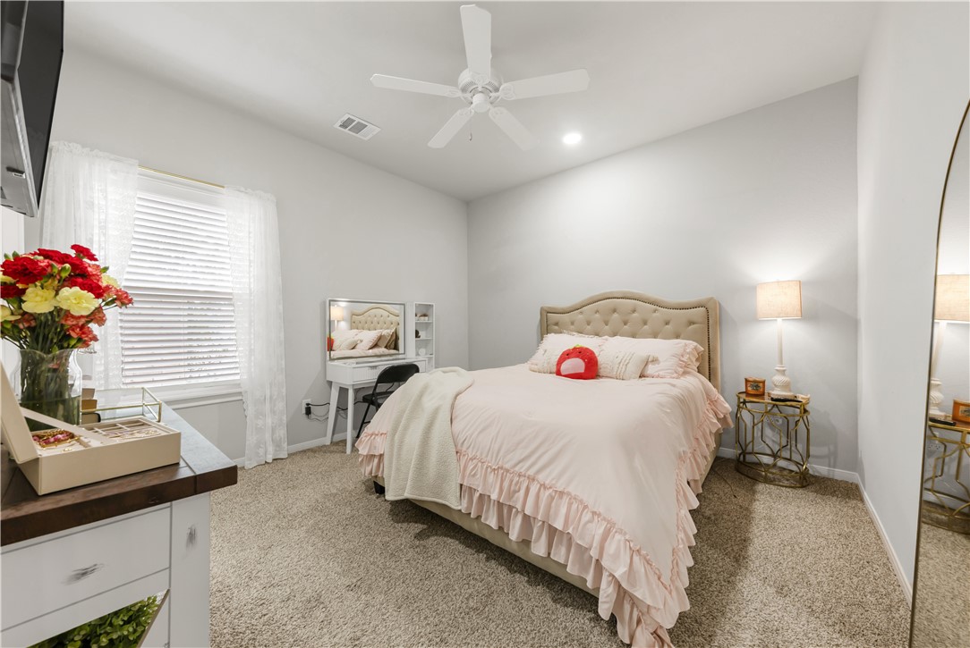 1326 Prairie Drive, Unit 113 Bryan, TX 77803 - Photo 15 of 21 Bedroom featuring light colored carpet, baseboards