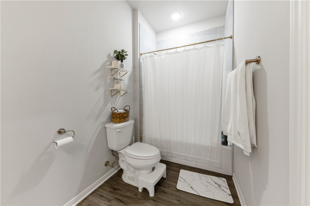 1326 Prairie Drive, Unit 113 Bryan, TX 77803 - Photo 16 of 21 Bathroom featuring toilet, wood finished floors, c