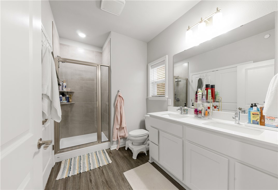 1326 Prairie Drive, Unit 113 Bryan, TX 77803 - Photo 18 of 21 Full bath featuring a shower stall, wood finished