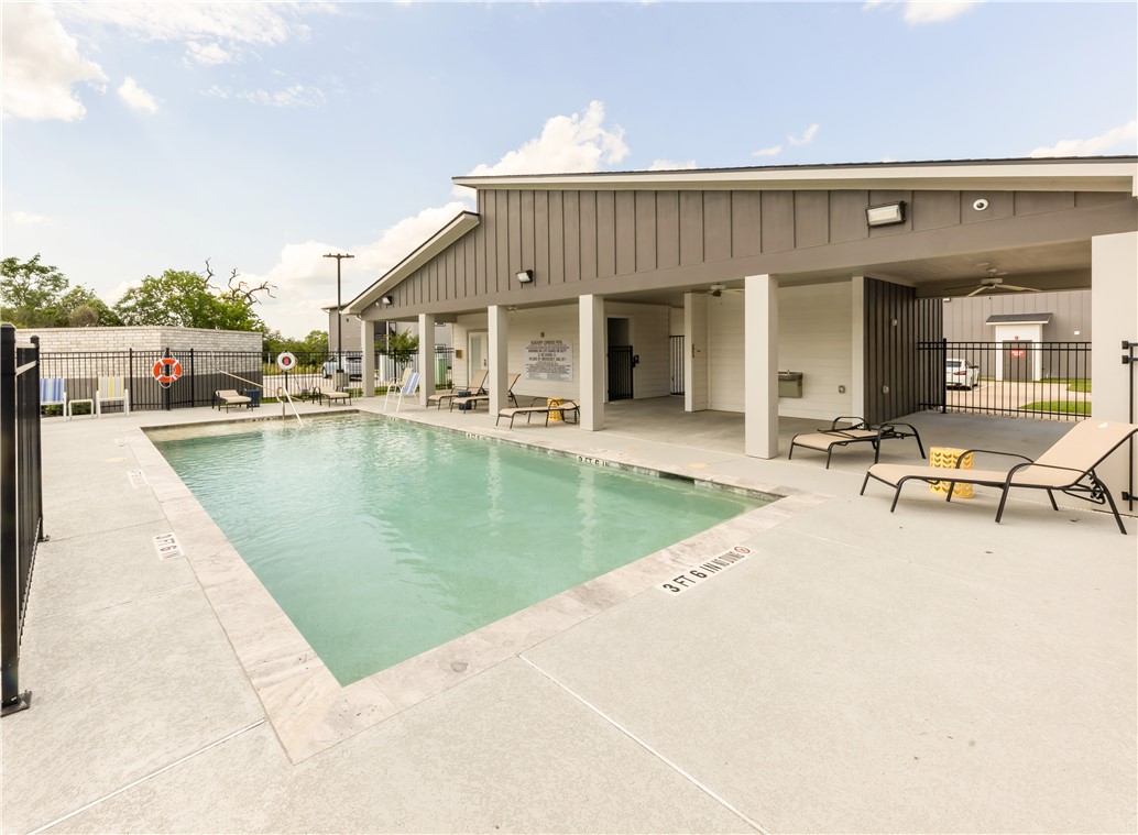 1326 Prairie Drive, Unit 113 Bryan, TX 77803 - Photo 20 of 21 Community pool with a patio area and fence