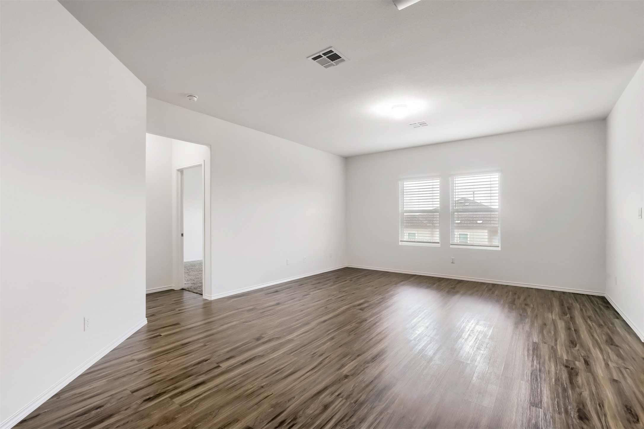 721 Mallow Road Leander, TX 78641 - Photo 10 of 22 The property features hardwood style floors and bright white walls