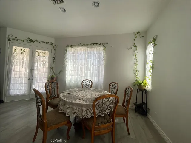 a view of a dining room with furniture and window