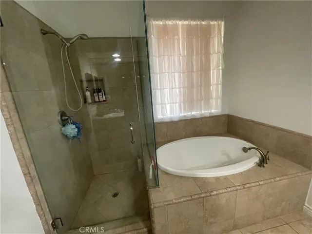 a bathroom with a shower and toilet