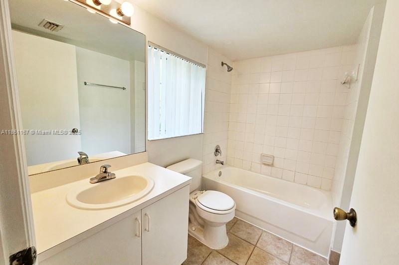 4149 Haverhill Road, Unit 1608 West Palm Beach, FL 33417 - Photo 11 of 29 a bathroom with a sink toilet a shower and a mirror