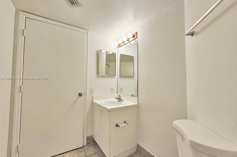 4149 Haverhill Road, Unit 1608 West Palm Beach, FL 33417 - Photo 12 of 29 a bathroom with a sink a toilet and shower