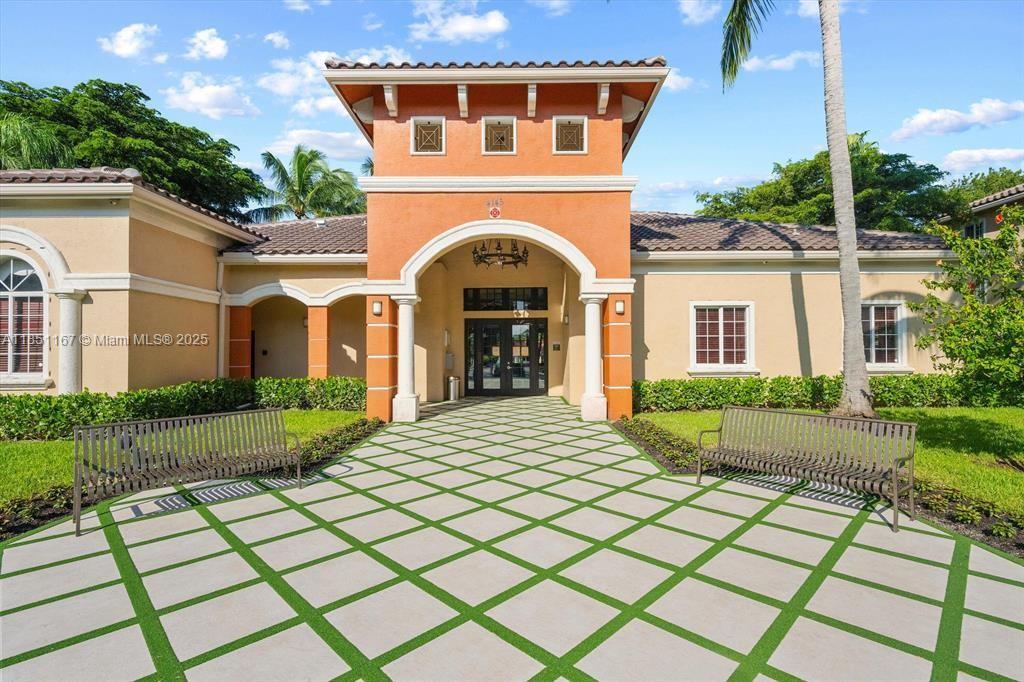 4149 Haverhill Road, Unit 1608 West Palm Beach, FL 33417 - Photo 20 of 29 a front view of a house with a yard