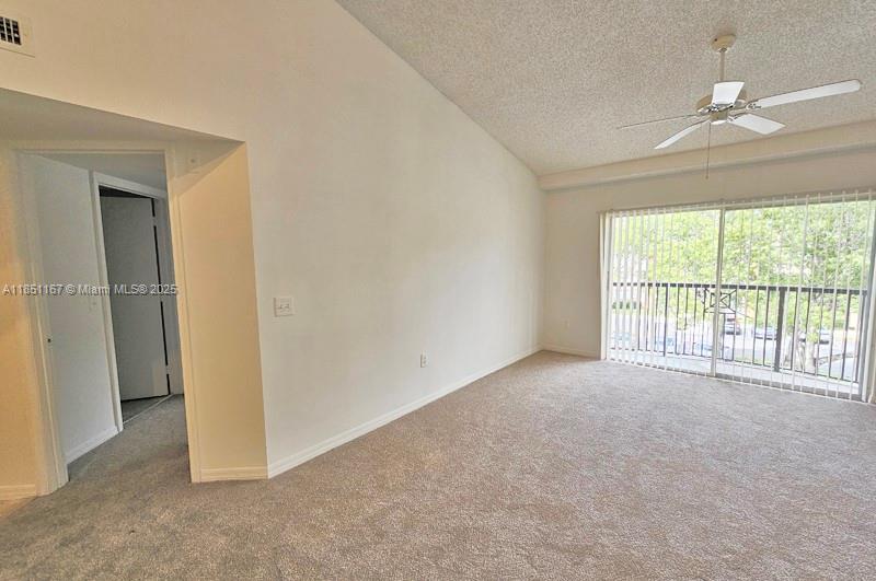 4149 Haverhill Road, Unit 1608 West Palm Beach, FL 33417 - Photo 2 of 29 a view of an empty room with a window