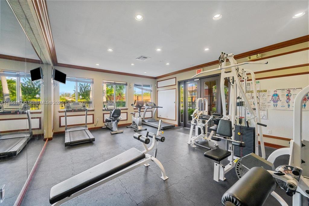 4149 Haverhill Road, Unit 1608 West Palm Beach, FL 33417 - Photo 22 of 29 a room with gym equipment and a large window