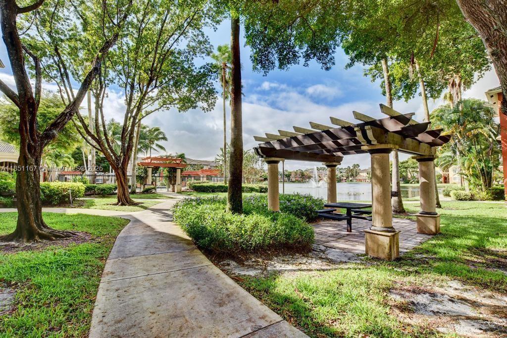 4149 Haverhill Road, Unit 1608 West Palm Beach, FL 33417 - Photo 27 of 29 a view of a park with plants and trees