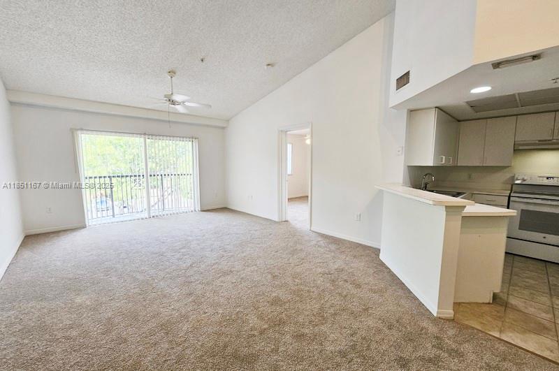 4149 Haverhill Road, Unit 1608 West Palm Beach, FL 33417 - Photo 3 of 29 an empty room with windows and cabinet