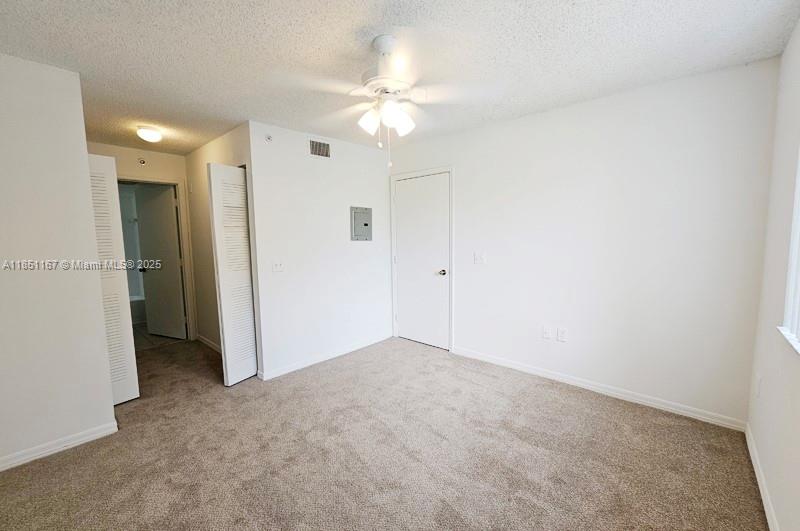 4149 Haverhill Road, Unit 1608 West Palm Beach, FL 33417 - Photo 8 of 29 wooden floor in an empty room