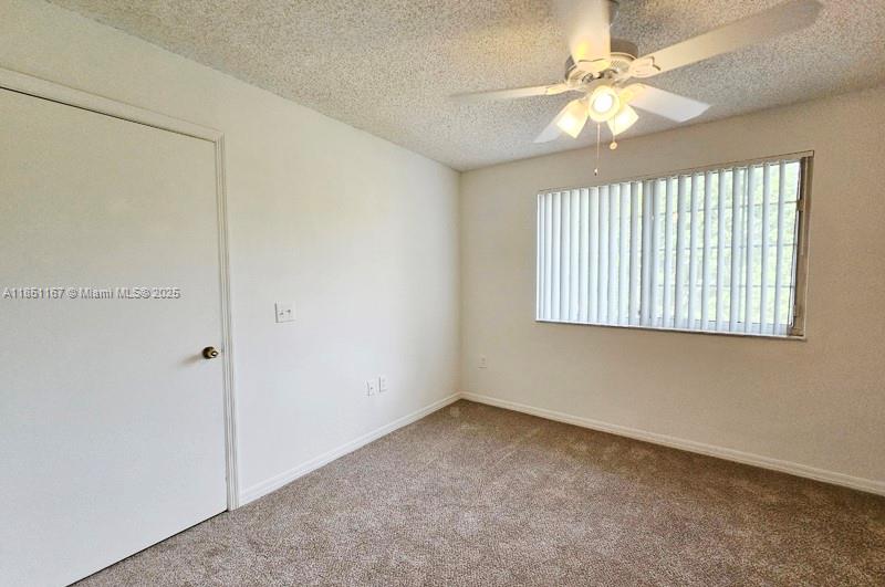 4149 Haverhill Road, Unit 1608 West Palm Beach, FL 33417 - Photo 9 of 29 a view of an empty room with a window