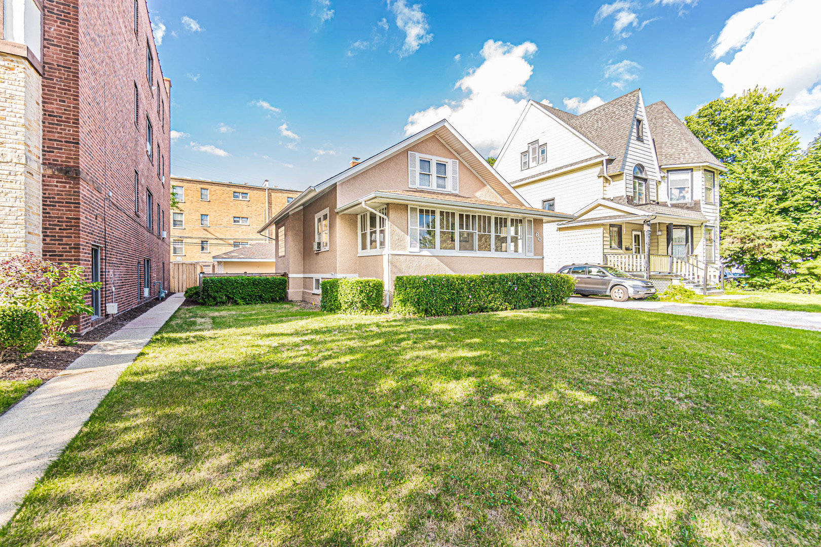 60 Pine Avenue Riverside, IL 60546 - Photo 22 of 27 a view of a house with a big yard and potted plants