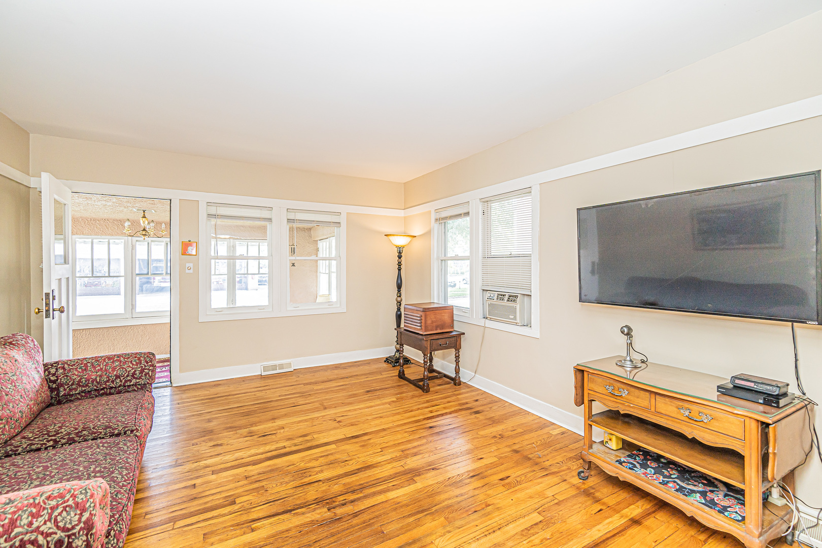 60 Pine Avenue Riverside, IL 60546 - Photo 6 of 27 a living room with furniture flat screen tv and a window