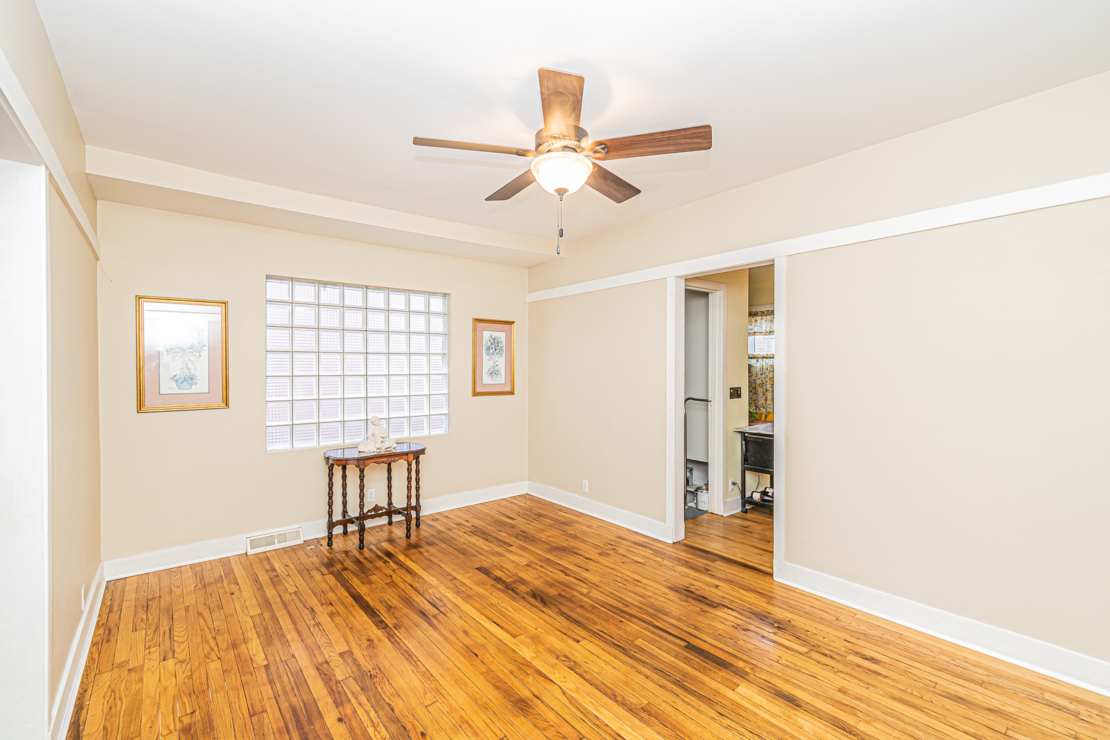 60 Pine Avenue Riverside, IL 60546 - Photo 8 of 27 a view of an empty room with wooden floor and a window