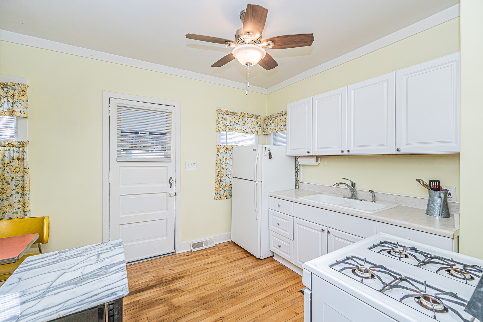 60 Pine Avenue Riverside, IL 60546 - Photo 9 of 27 a kitchen with a stove cabinets and window