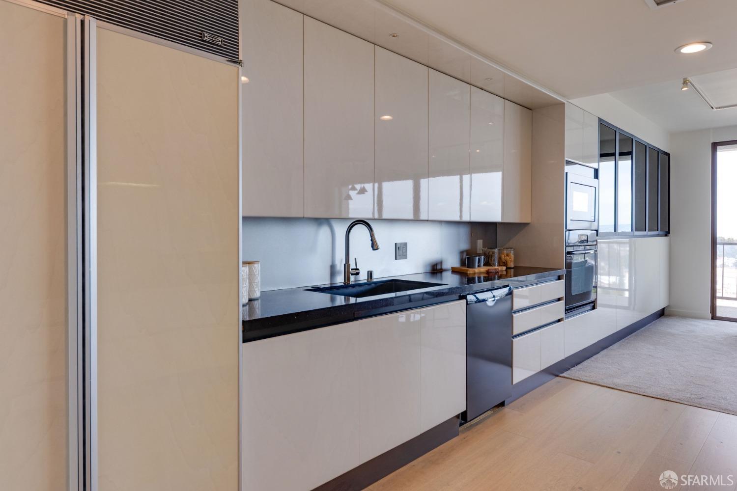 50 Mounds Road, Unit 404 San Mateo, CA 94402 - Photo 12 of 23 a kitchen with stainless steel appliances granite countertop a refrigerator sink and stove