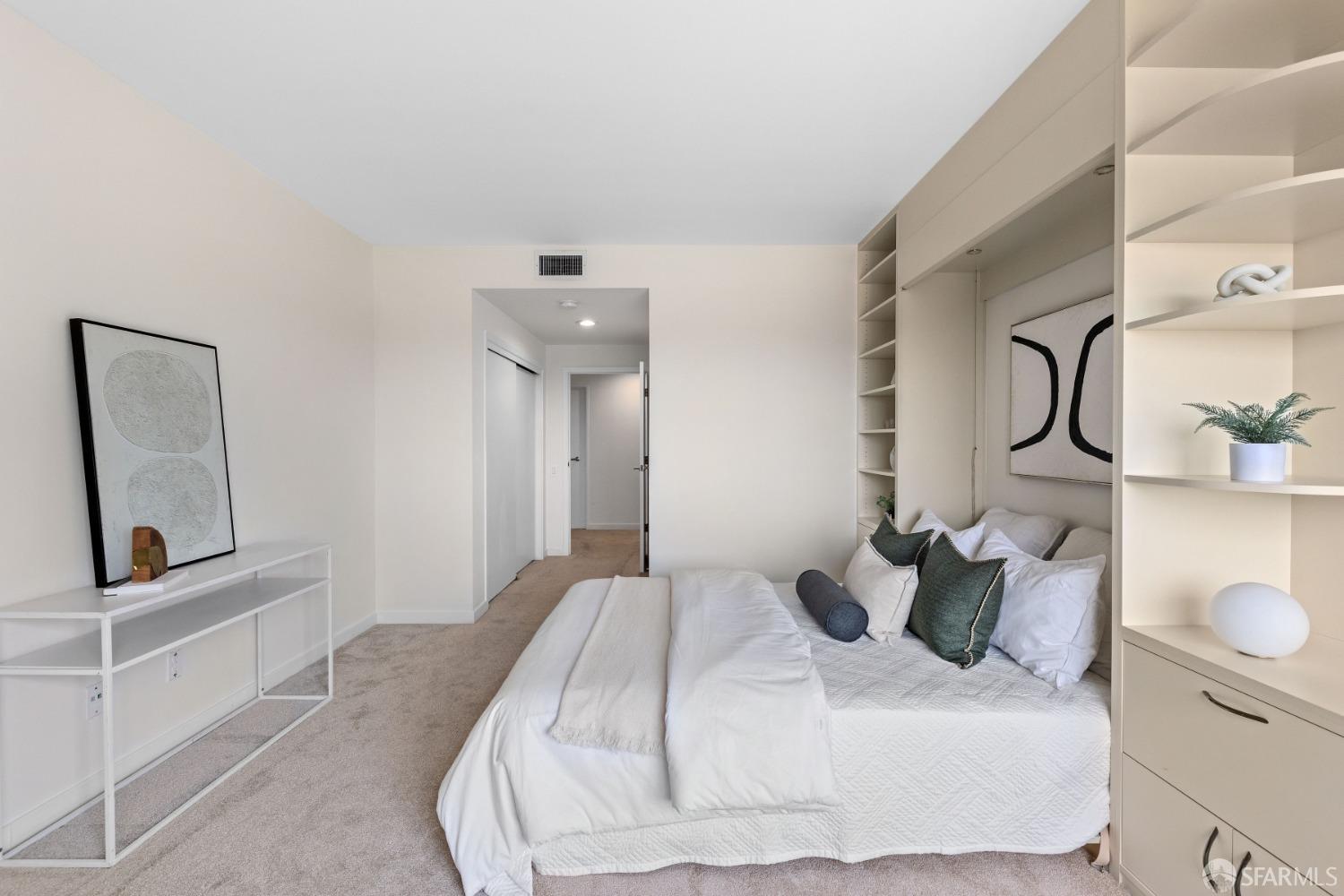 50 Mounds Road, Unit 404 San Mateo, CA 94402 - Photo 16 of 23 a bedroom with a bed and a painting on the wall