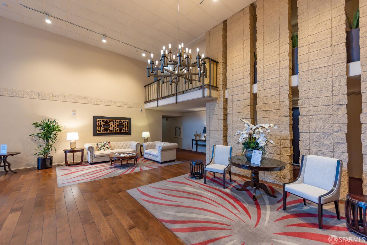 50 Mounds Road, Unit 404 San Mateo, CA 94402 - Photo 19 of 23 a living room with furniture a chandelier and a fireplace