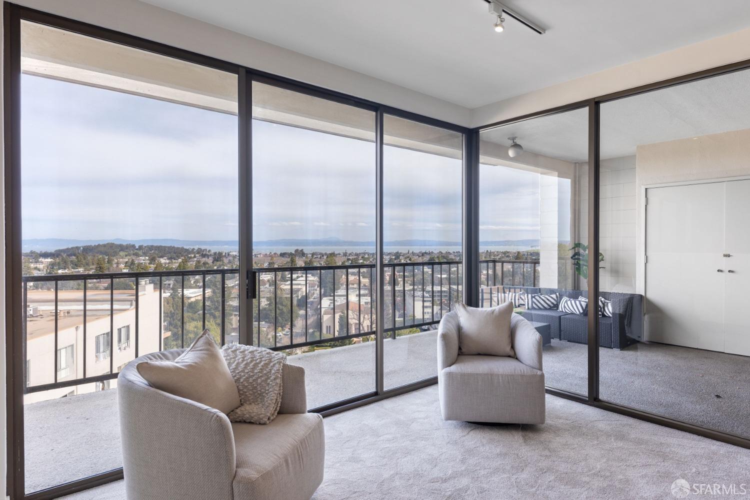50 Mounds Road, Unit 404 San Mateo, CA 94402 - Photo 7 of 23 a living room with furniture and floor to ceiling windows