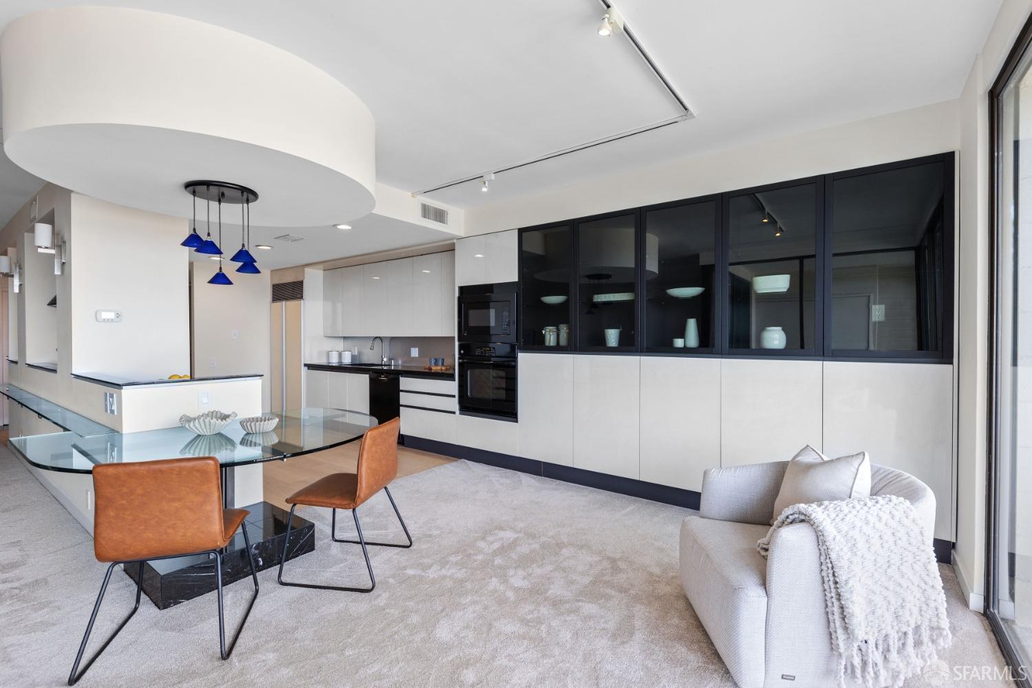 50 Mounds Road, Unit 404 San Mateo, CA 94402 - Photo 9 of 23 a living room with furniture and kitchen view