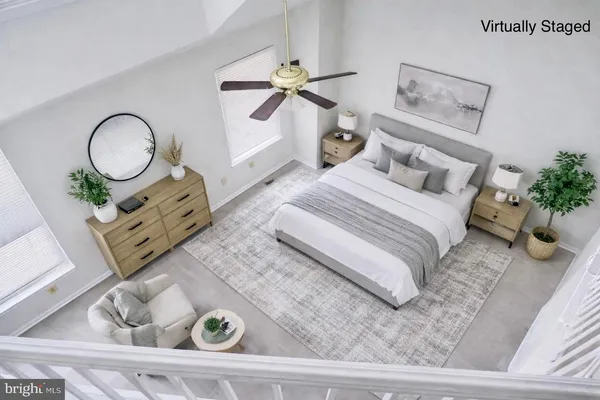 a bedroom with bed and wooden floor