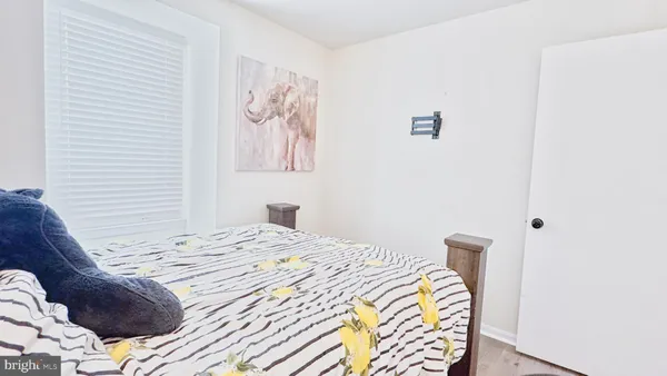 a bedroom with a bed and a closet