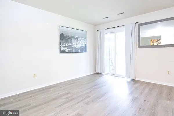 a view of living room with furniture and floor to ceiling windows