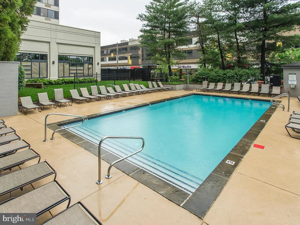 2001-00 Hamilton Street, Unit 1026 Philadelphia, PA 19130 - Photo 6 of 7 a view of swimming pool with outdoor seating and a garden
