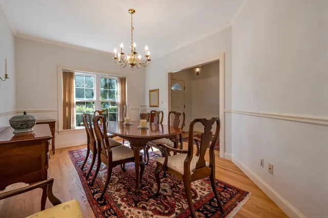 a view of a dining room with furniture and window