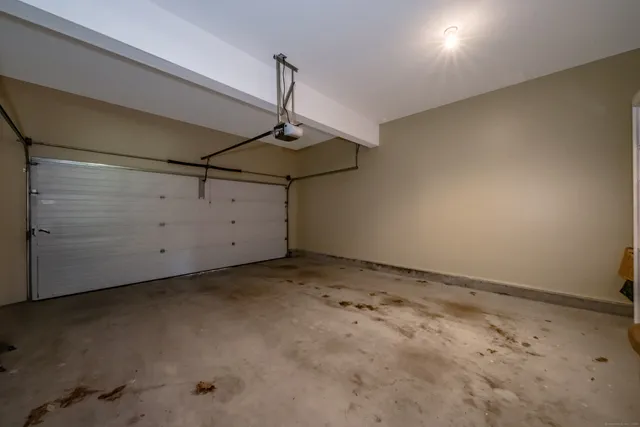 a view of empty room with wooden ceiling