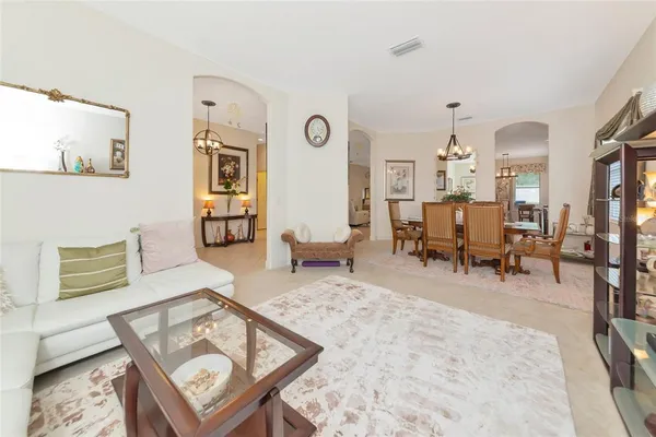 a kitchen with kitchen island a counter top space stainless steel appliances and cabinets
