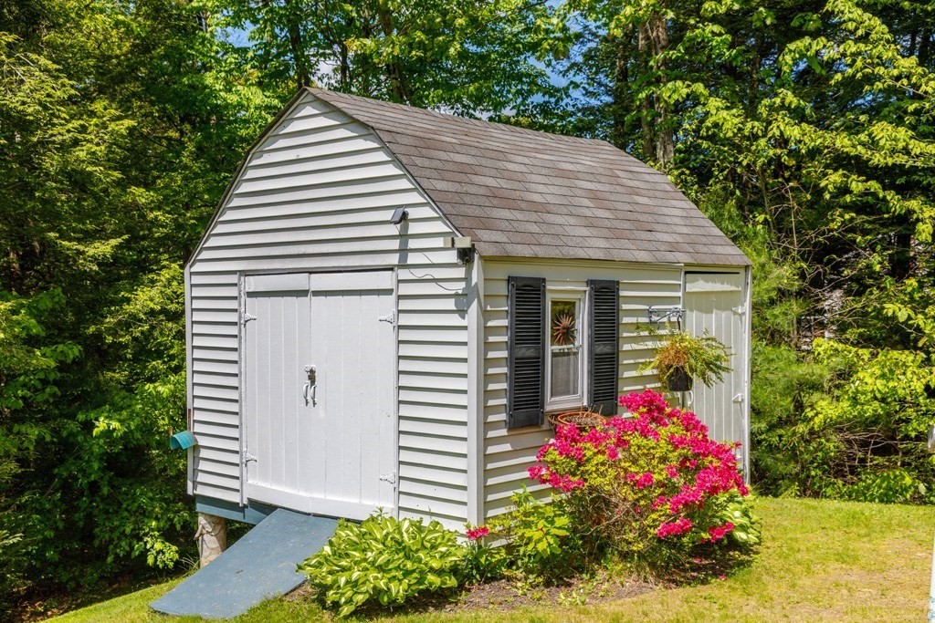 101 Holt Road Ashburnham, MA 01430 - Photo 18 of 22 a view of a house with a yard and garden
