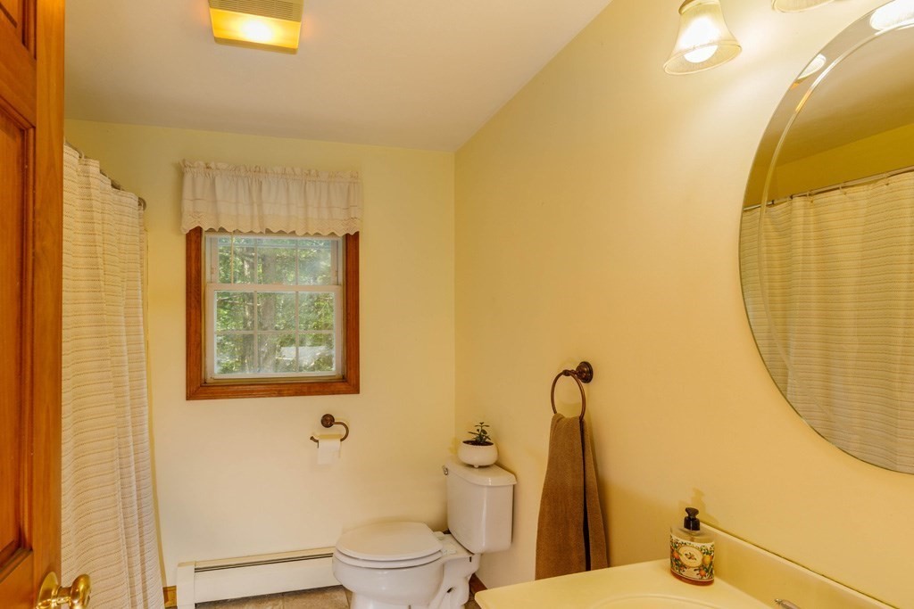 101 Holt Road Ashburnham, MA 01430 - Photo 7 of 22 a bathroom with a toilet sink and mirror