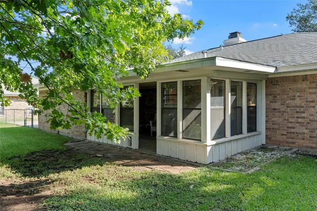 a view of a house with a garden