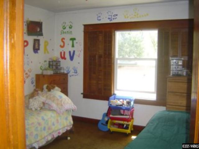 523 West 11th Street Reno, NV 89503 - Photo 4 of 9 a bedroom with a bed and a window