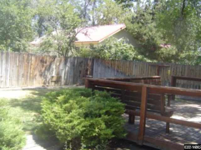 523 West 11th Street Reno, NV 89503 - Photo 8 of 9 a view of a backyard with plants and wooden fence