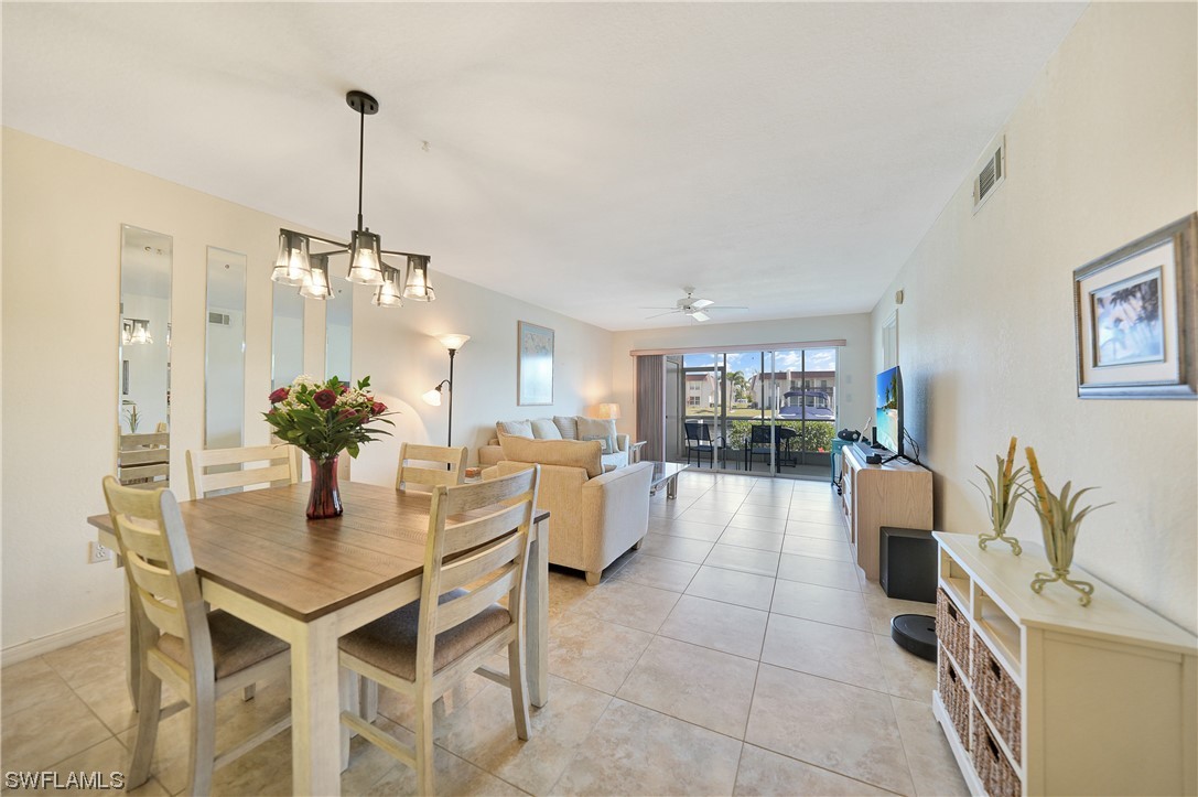 220 Coldeway Drive, Unit 112 Punta Gorda, FL 33950 - Photo 11 of 50 a dining room with furniture and chandelier