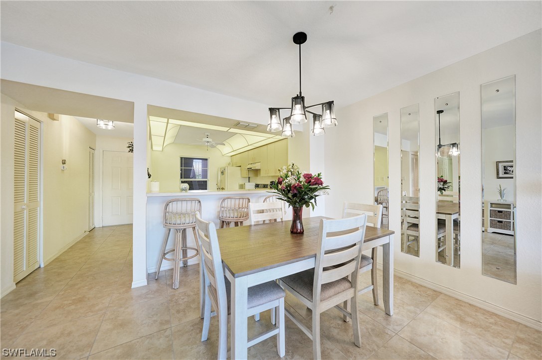 220 Coldeway Drive, Unit 112 Punta Gorda, FL 33950 - Photo 12 of 50 a dining room with furniture and window