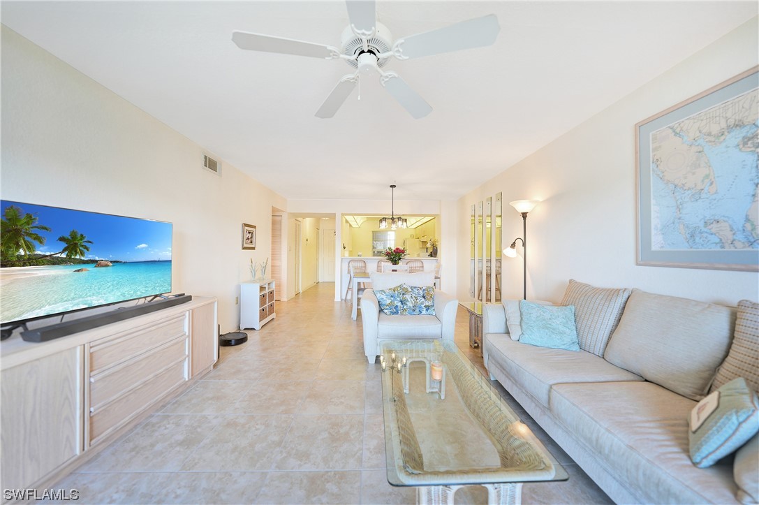 220 Coldeway Drive, Unit 112 Punta Gorda, FL 33950 - Photo 14 of 50 a living room with furniture and a large window