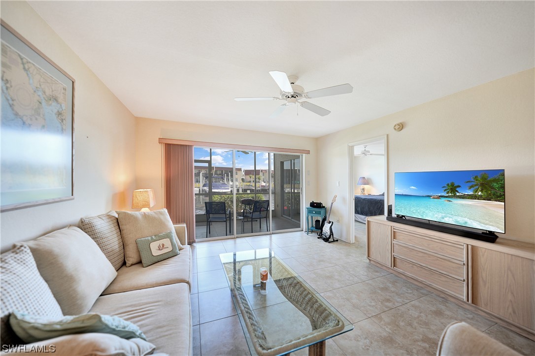 220 Coldeway Drive, Unit 112 Punta Gorda, FL 33950 - Photo 16 of 50 a living room with furniture and a flat screen tv
